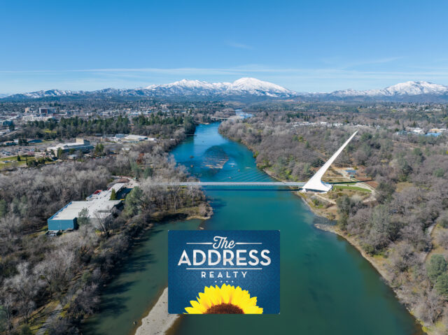 Redding's Sundial Bridge in winter with snowy mountains in background