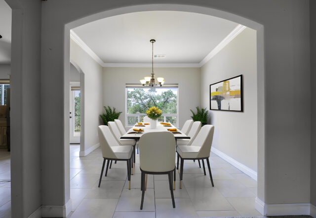 Virtually staged formal dining room by The Address Realty